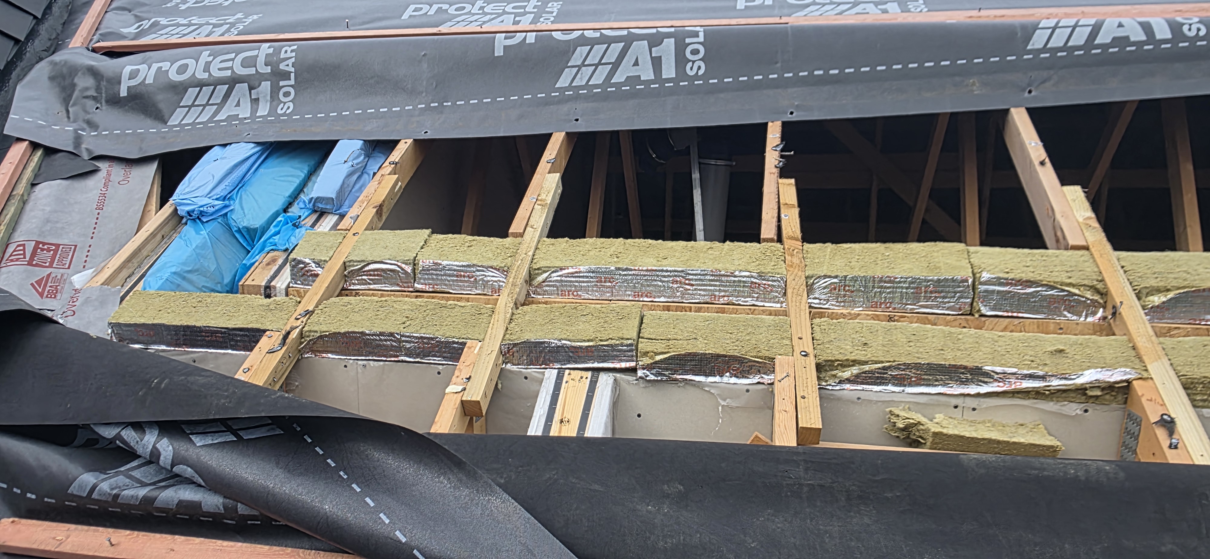 Exposed roof construction and insulation details at The Courtyards