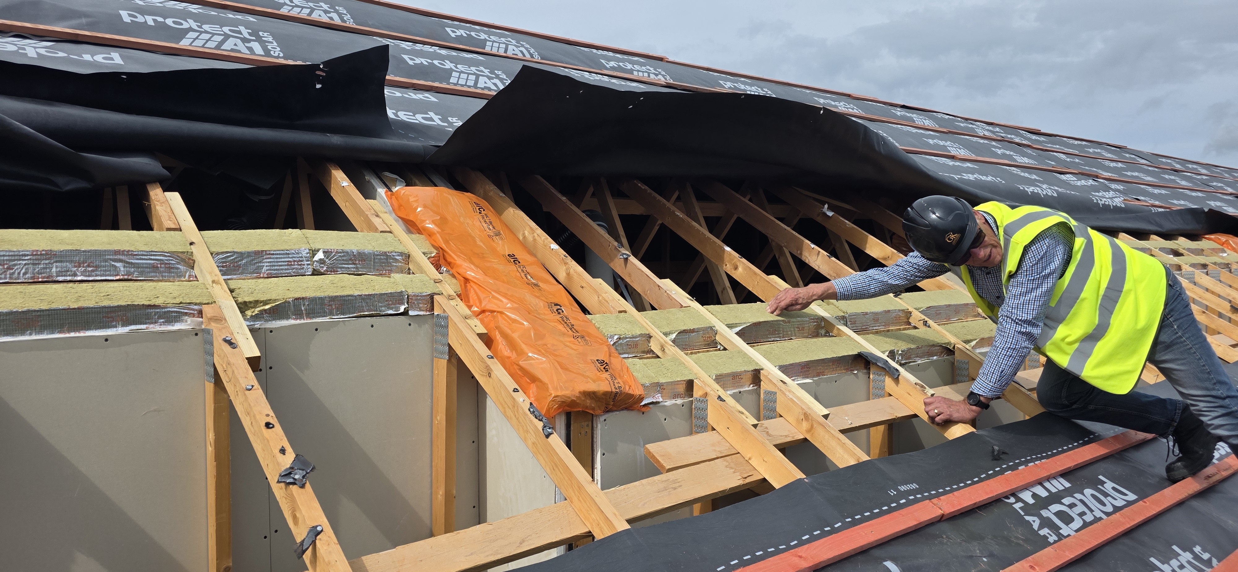 Inspection of exposed roof construction and insulation at The Courtyards
