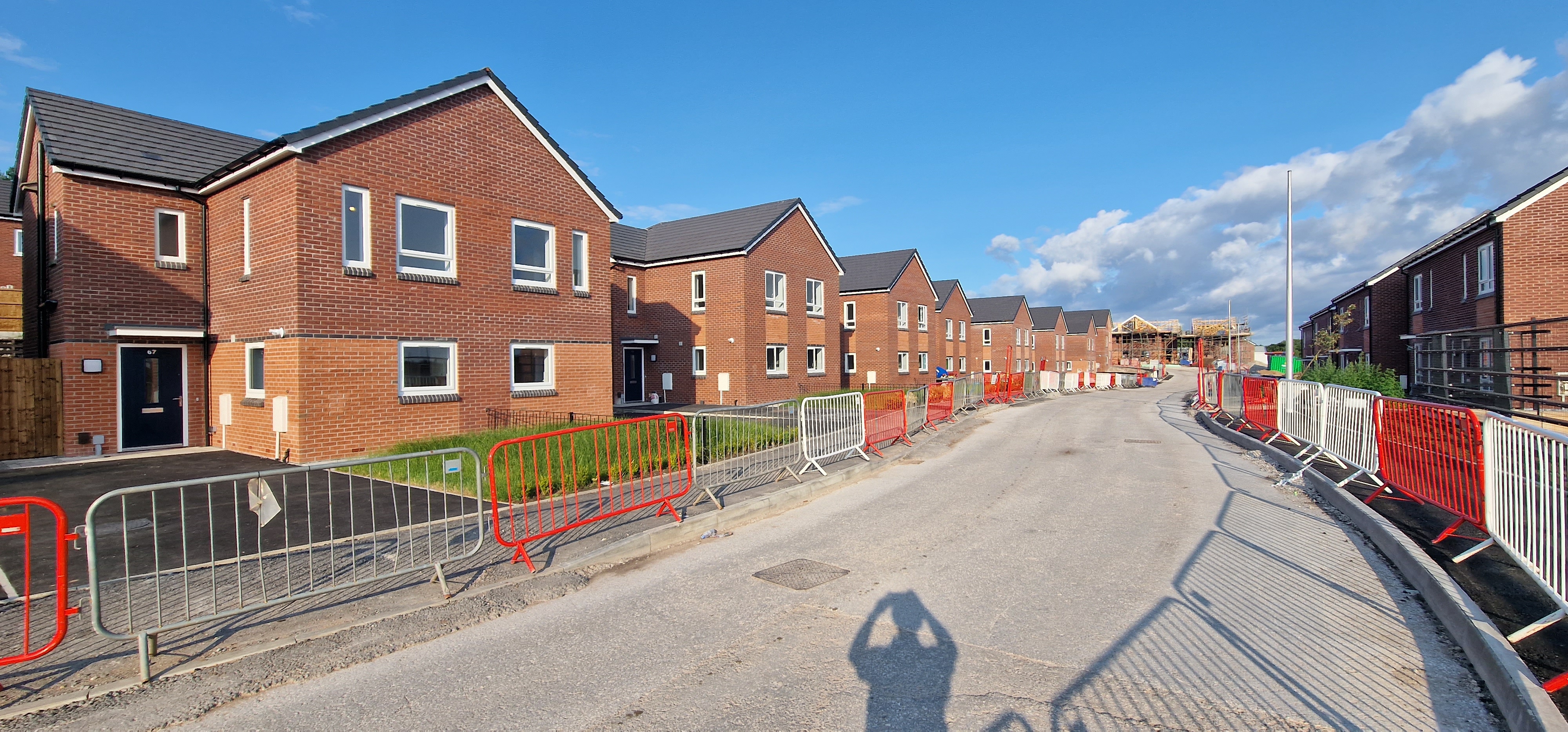 Street view of new homes during construction at Halton Court